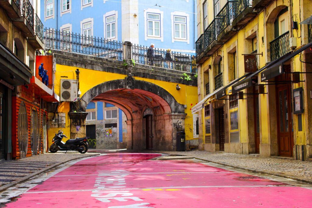 Lisbon street with a tuk-tuk